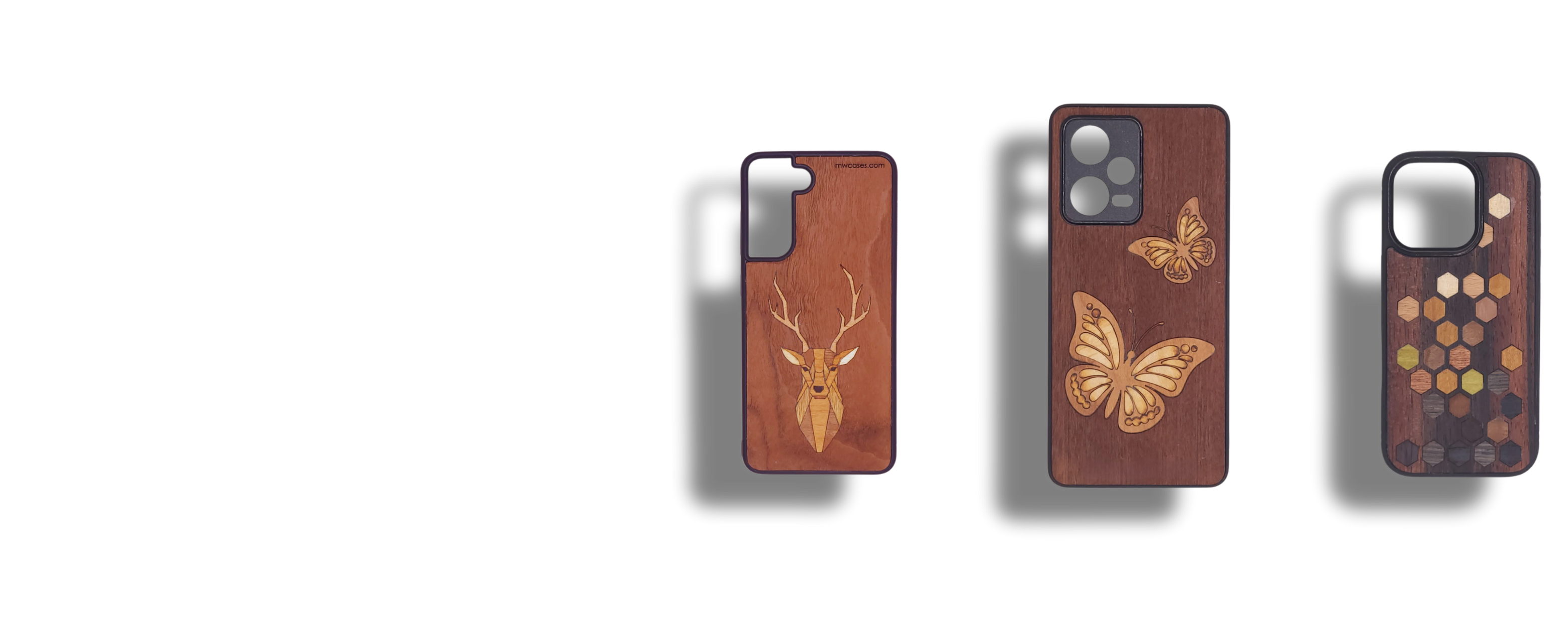 Three wooden phone cases with deer, butterfly, and abstract hexagonal designs on a transparent background