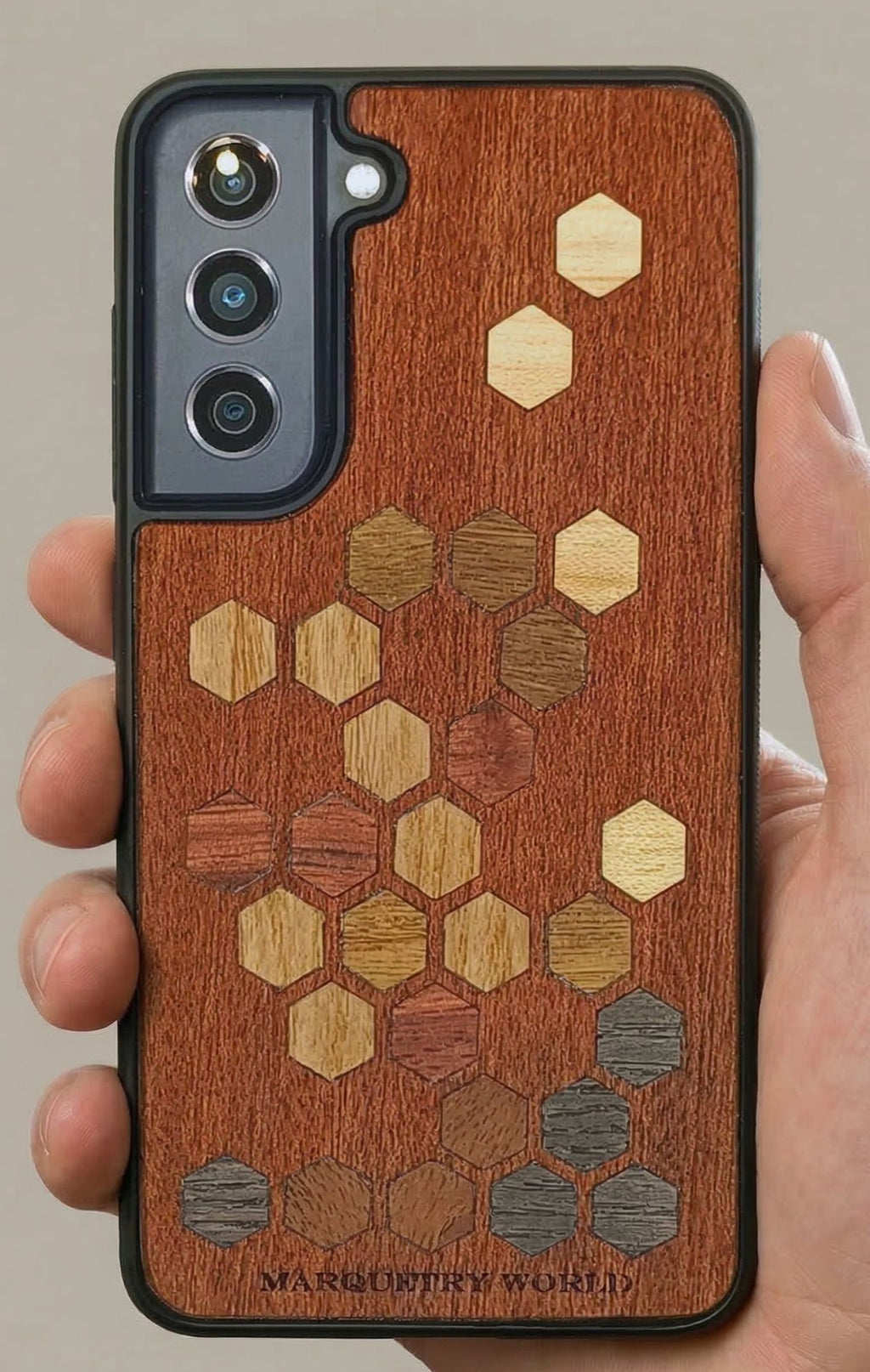 wooden marquetry phone case with hexagon motiv in hand
