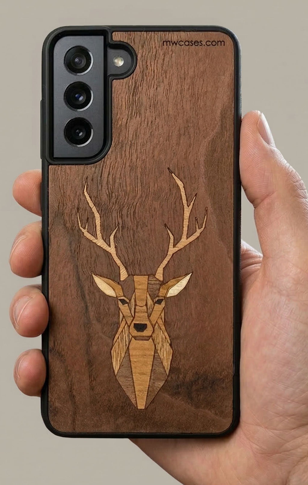 wooden marquetry phone case with deere motiv in hand
