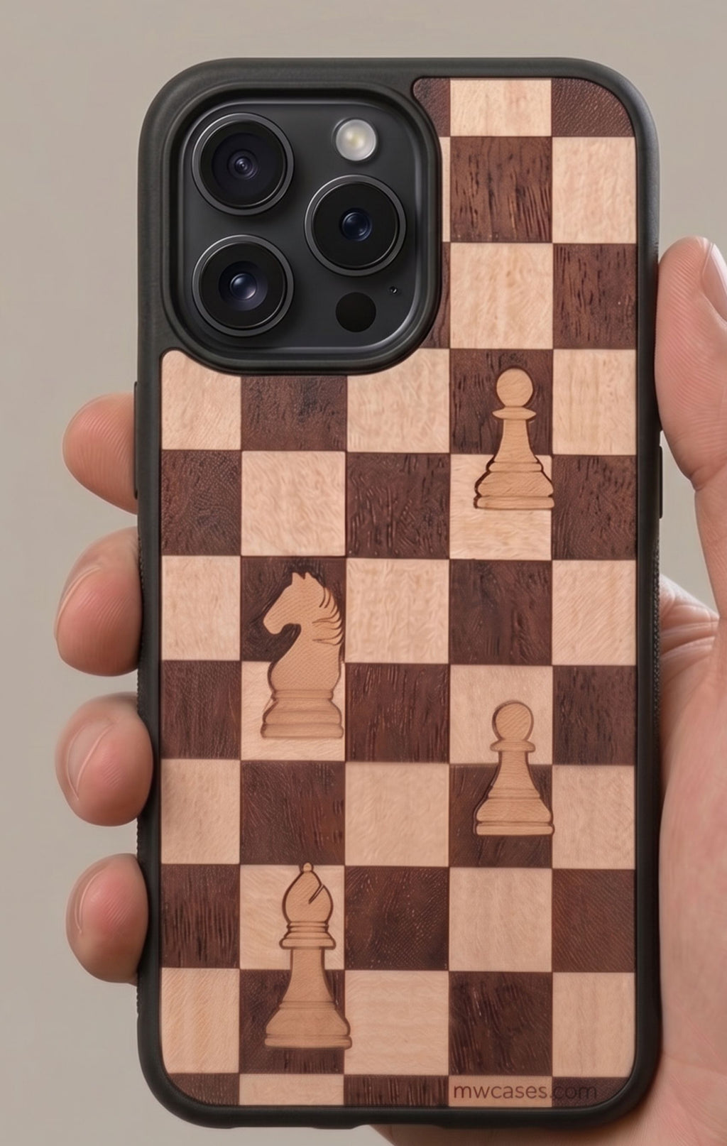 wooden phone case with chessnoard pattern hold in a hand